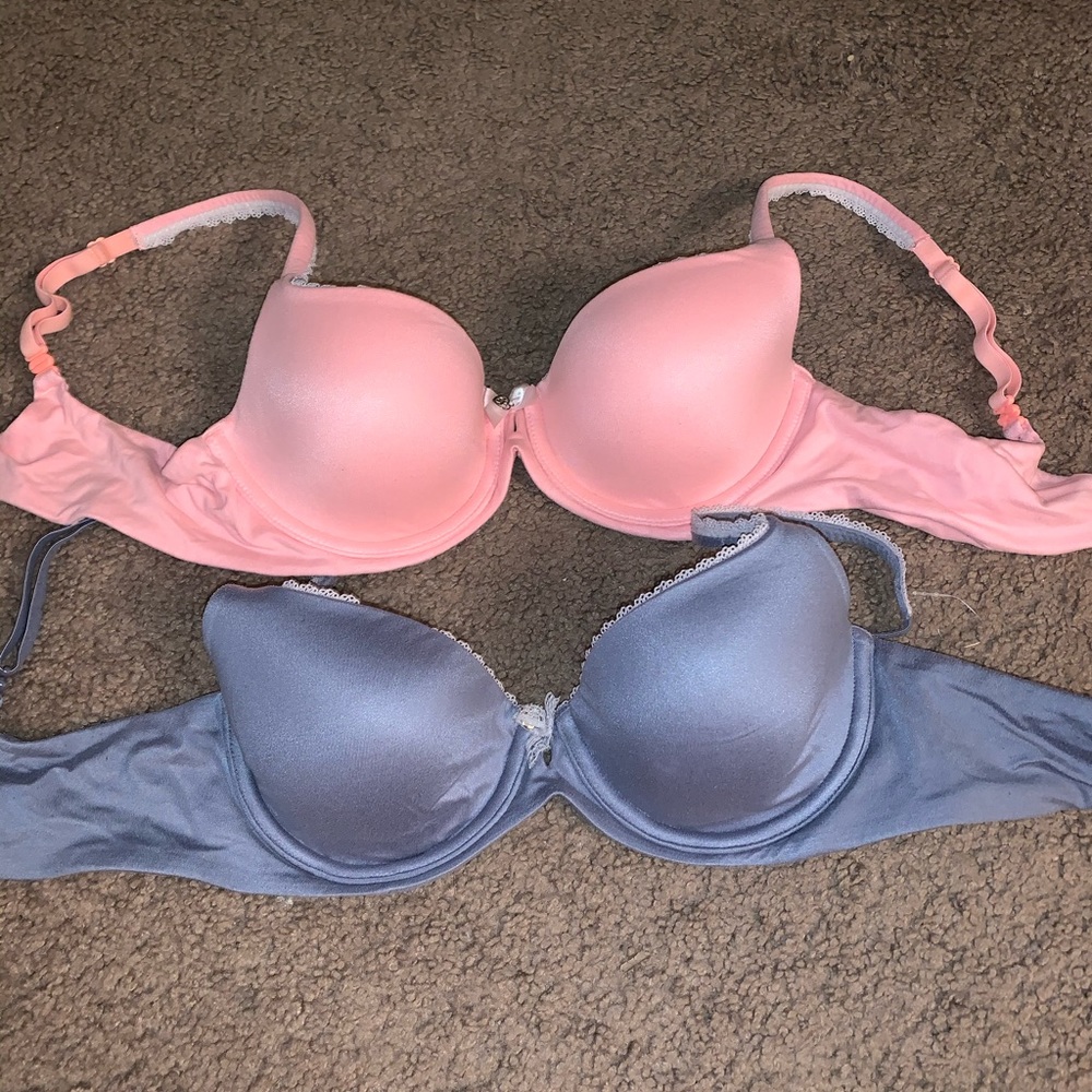Two Victoria’s Secret bras, pink and periwinkle